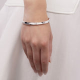 Radley silver plated jumping dog bangle, UK version