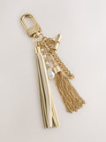 Gold beaded shell bag charm with tassel and pearls, imported from UK