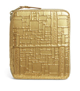 Harrods Comme Des Garçons Embossed Logo Zipped Leather Wallet- Buy online at McGrocer