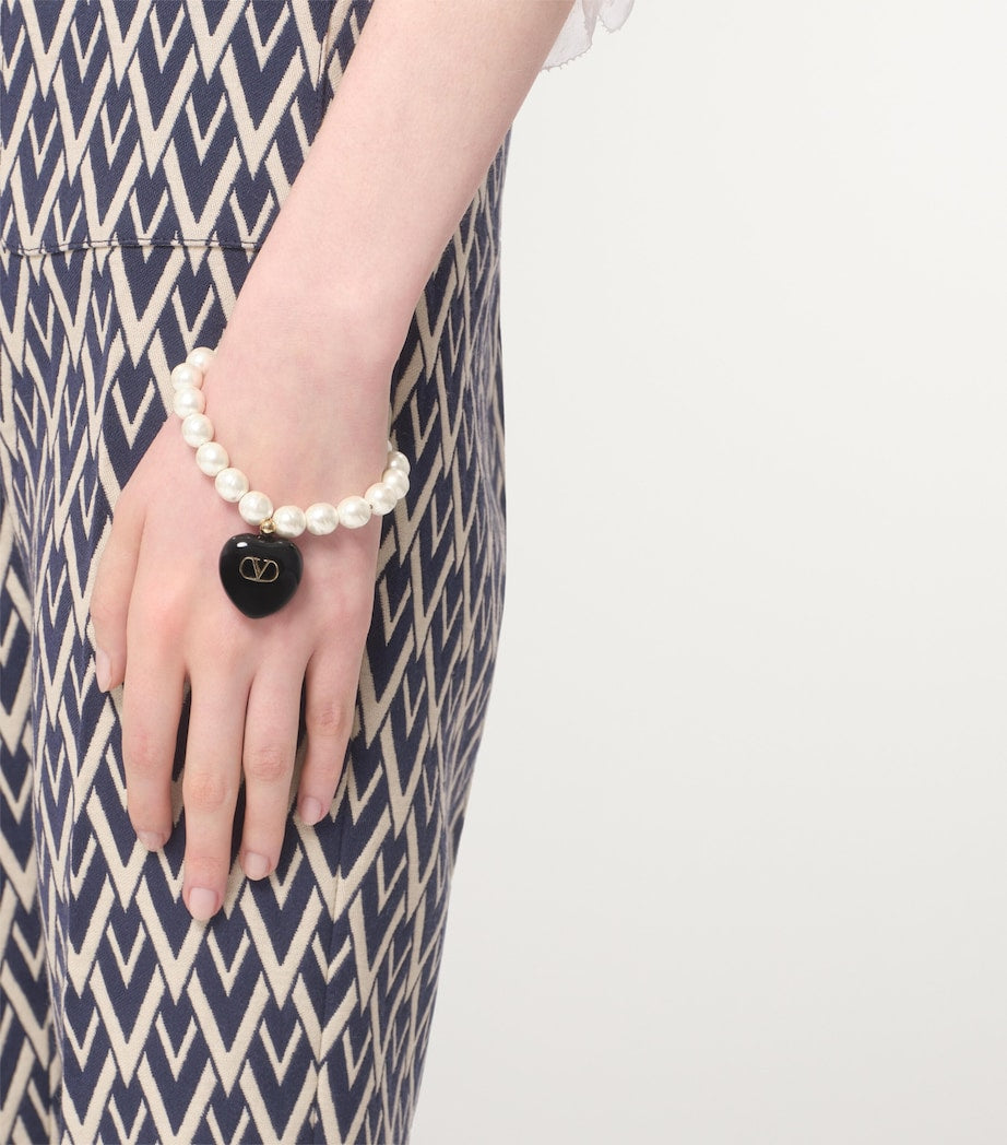 Valentino Garavani Coeur Royal beaded bracelet with heart pendant, imported from the UK