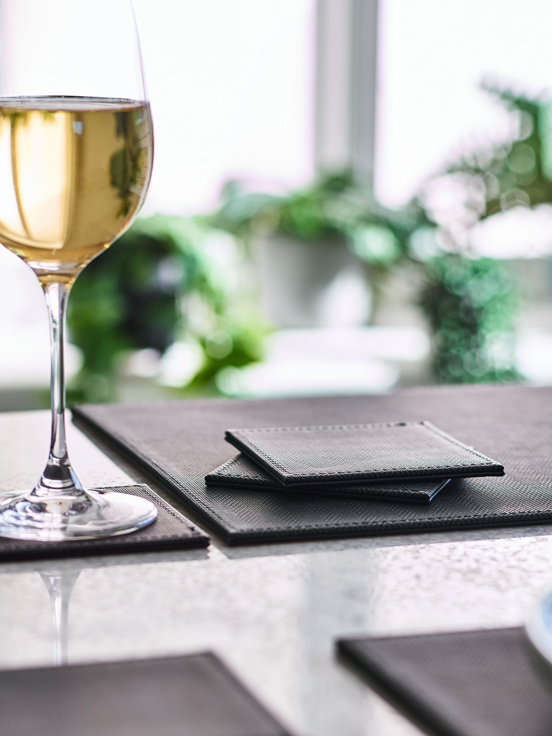 Black reversible faux leather placemats and coasters set of 4 (British brand)