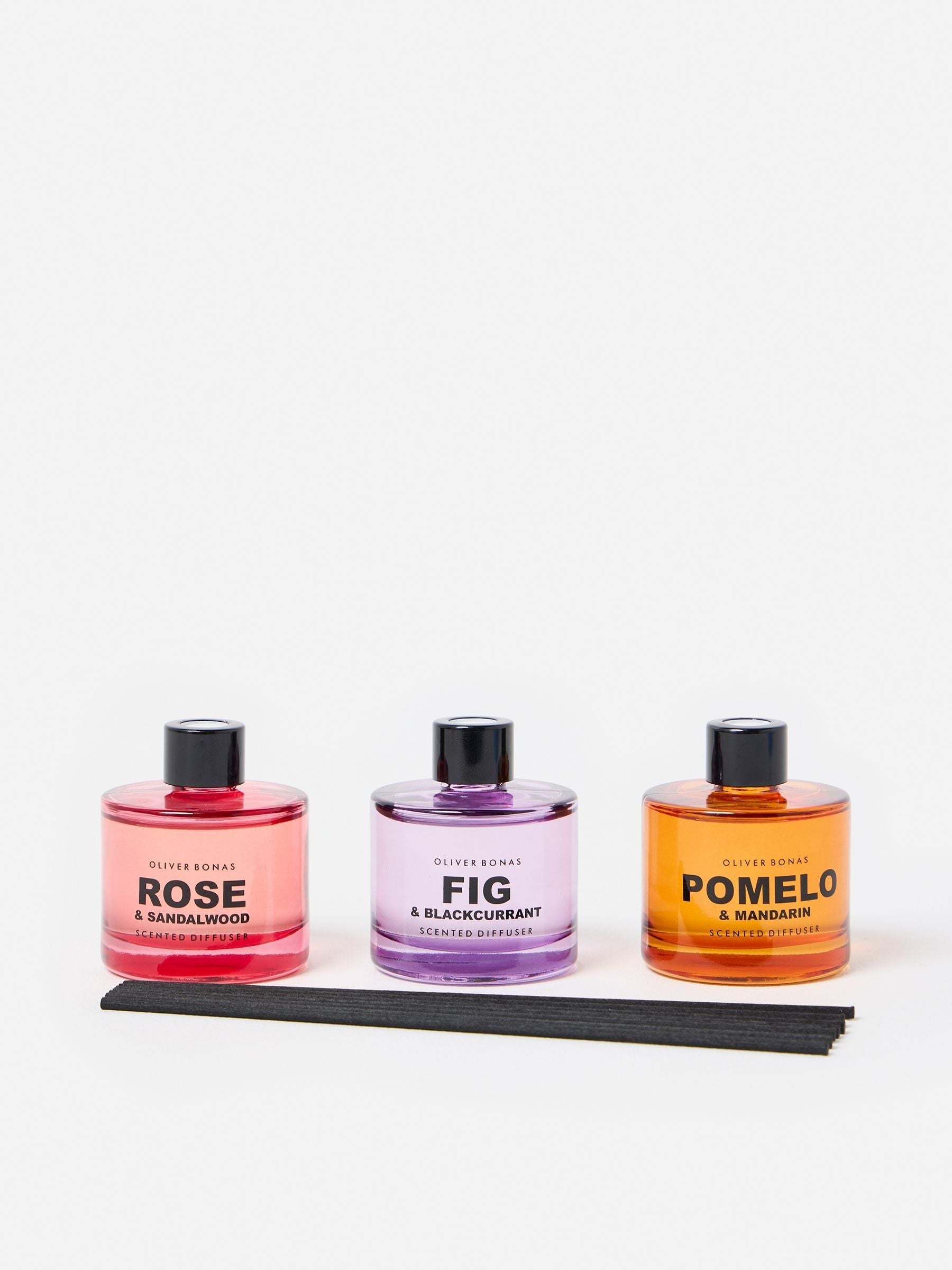 Oliver Bonas reed diffuser trio with Fig, Pomelo, and Rose fragrances, imported from the UK