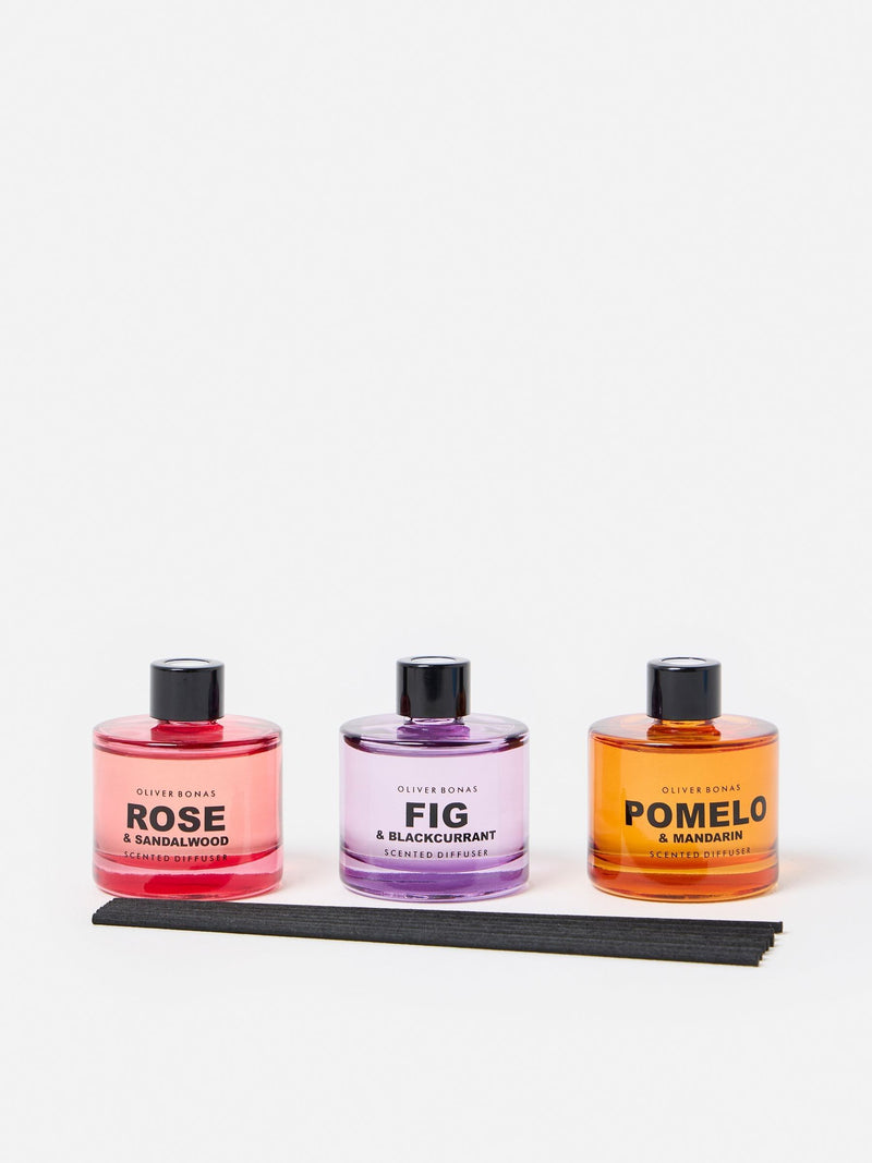 Oliver Bonas reed diffuser trio with Fig, Pomelo, and Rose fragrances, imported from the UK