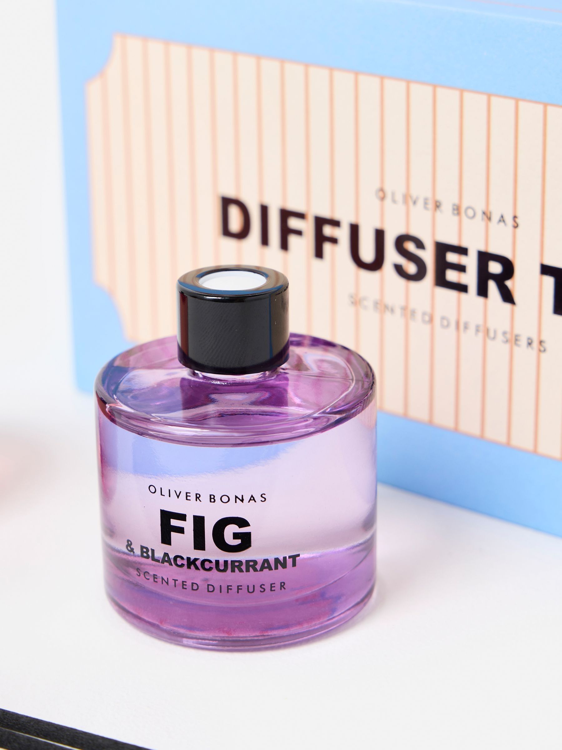 Oliver Bonas reed diffuser trio with Fig, Pomelo, and Rose fragrances, imported from the UK
