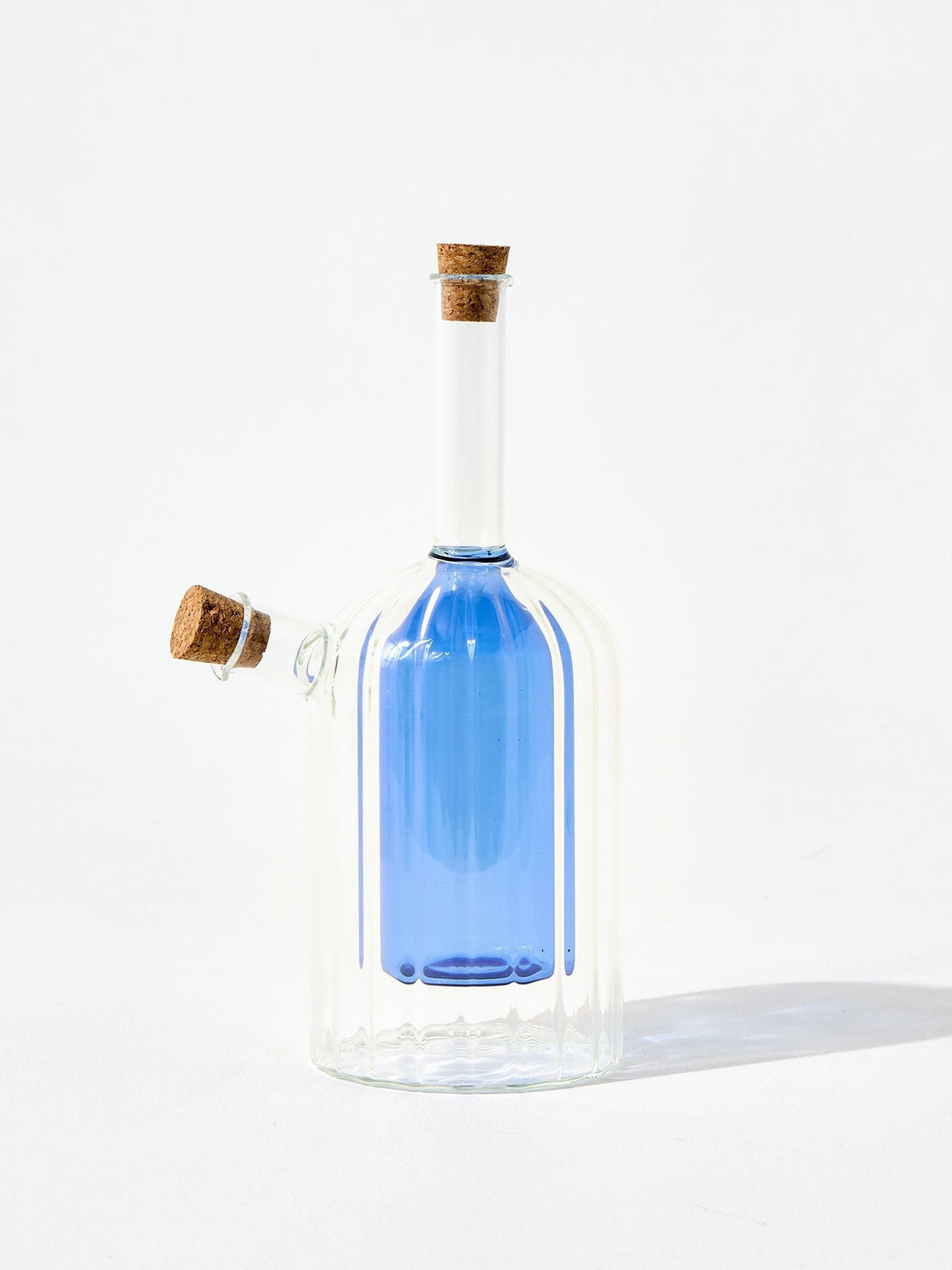 Oliver Bonas blue glass oil and vinegar bottle, UK version