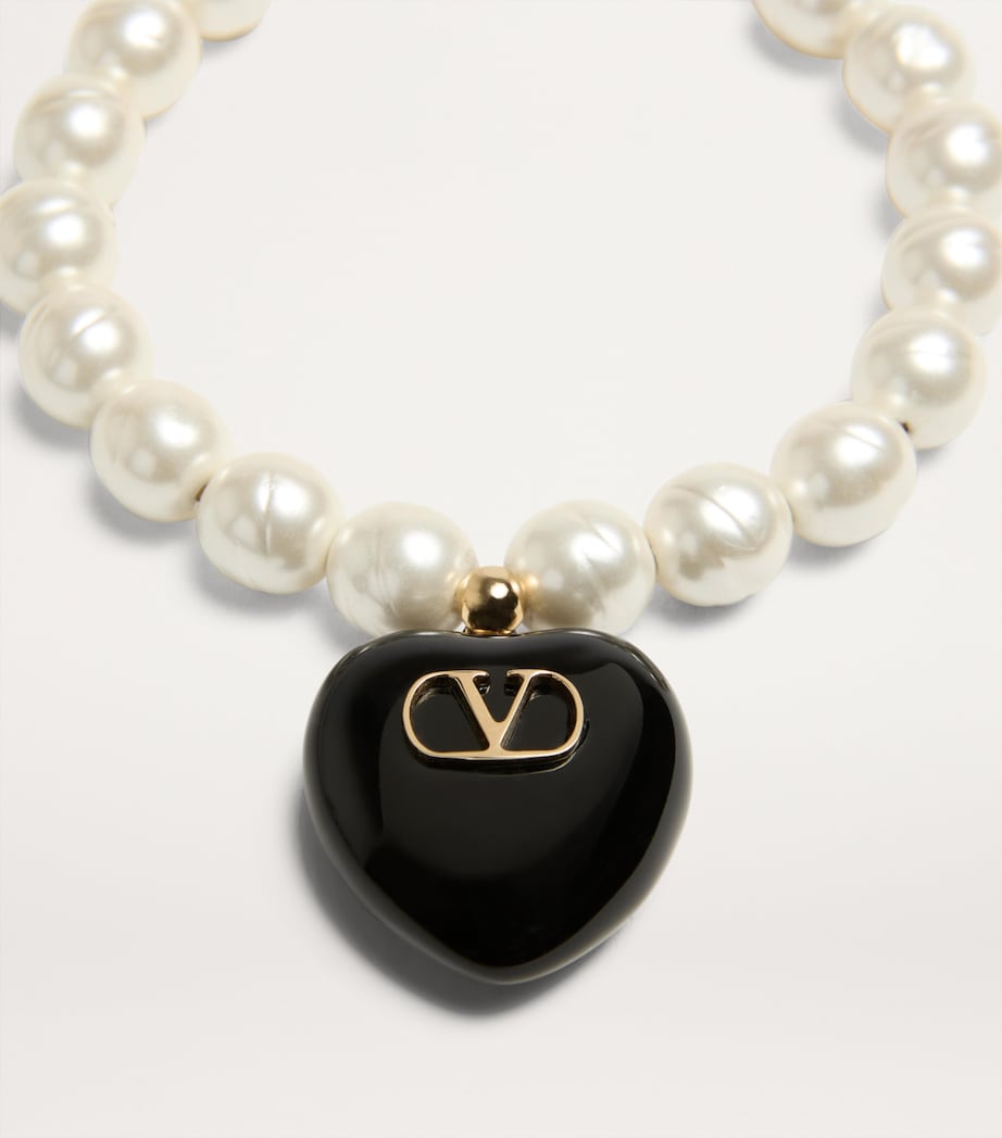 Valentino Garavani Coeur Royal beaded bracelet with heart pendant, imported from the UK